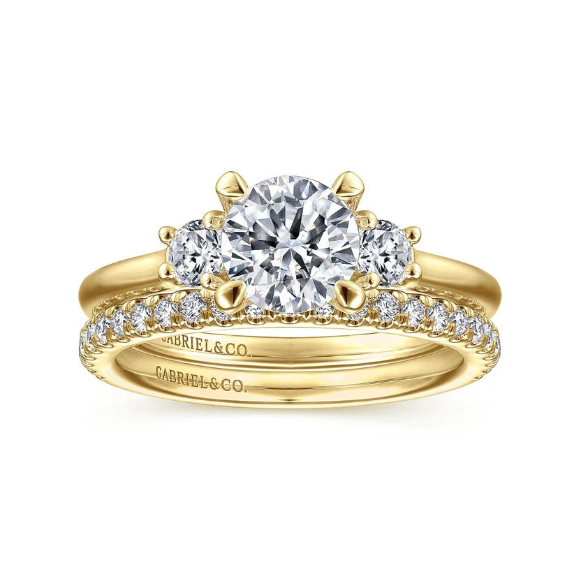A Yellow Gold Round Three Stone Semi-Mount Ring available at Dunkin’s Diamonds.