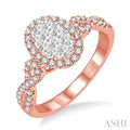 5/8 Ctw Oval Shape Round Cut Diamond Lovebright Ring in 14K Rose and White Gold