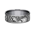 The Explorer This 7mm comfort fit ring is made with Grey Tantalum, featuring a Topography design
