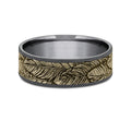 The Covey This 7.5mm comfort fit ring is made with Grey Tantalum and 14k Yellow Gold , featuring a feather design