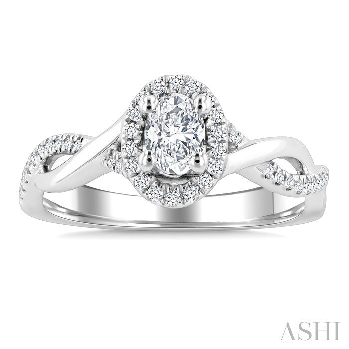 1/2 Ctw Twisted Shank Round Cut Diamond Halo Engagement Ring With 1/3 Ct Oval Cut Diamond Center Stone in 14K White Gold