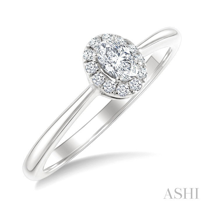 1/4 Ctw Oval and Round Cut Diamond Fashion Halo Ring in 14K White Gold