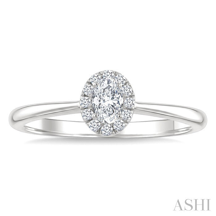 1/4 Ctw Oval and Round Cut Diamond Fashion Halo Ring in 14K White Gold