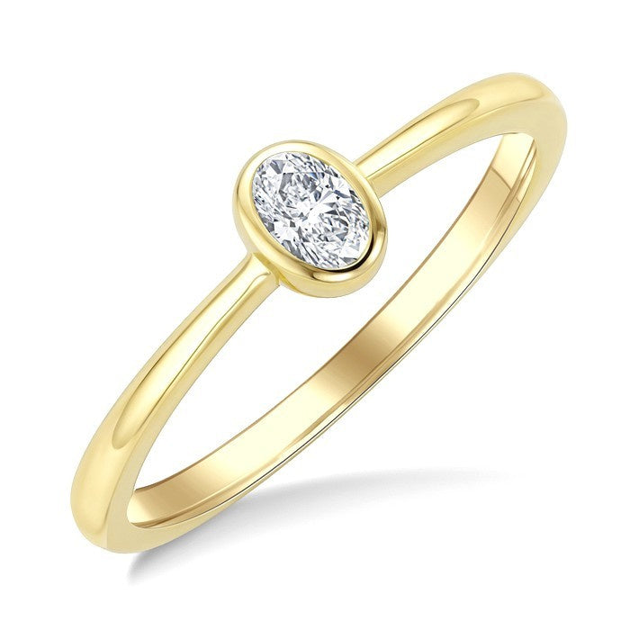 1/5 Ctw Bezel Set Oval Cut Diamond Fashion Ring in 14K Yellow Gold