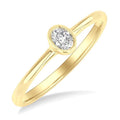 1/6 Ctw Petite Bezel Set Oval Cut Diamond Fashion Ring in 10K Yellow Gold
