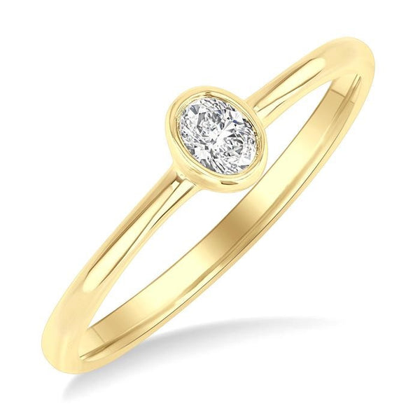 1/6 Ctw Petite Bezel Set Oval Cut Diamond Fashion Ring in 10K Yellow Gold