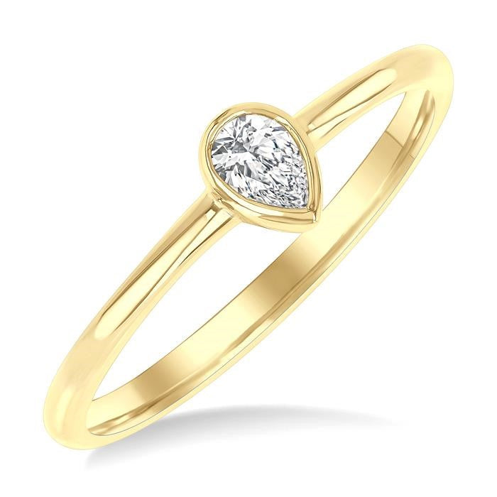 1/6 Ctw Petite Bezel Set Pear Cut Diamond Fashion Ring in 10K Yellow Gold