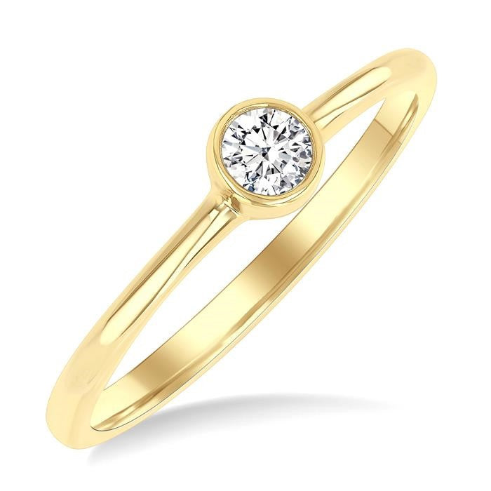 1/6 Ctw Petite Bezel Set Round Cut Diamond Fashion Ring in 10K Yellow Gold