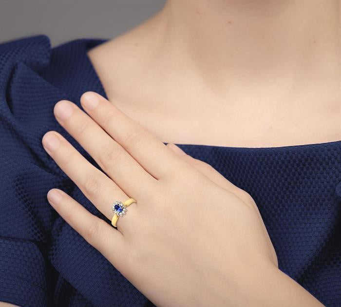 5x3mm Oval Cut Tanzanite and 1/10 Ctw Round Cut Diamond Ring in 10K Yellow Gold