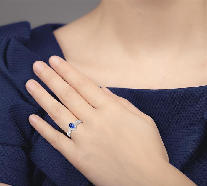 6x4 MM Pear Shape Tanzanite and 1/6 Ctw Round Cut Diamond Ring in 14K White Gold