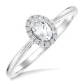 5x3 MM Oval Shape White Topaz and 1/20 Ctw Round Cut Diamond Halo Semi-Precious Ring in 10K White Gold