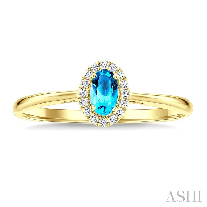 5x3 MM Oval Shape Blue Topaz and 1/20 Ctw Round Cut Diamond Halo Semi-Precious Ring in 10K Yellow Gold
