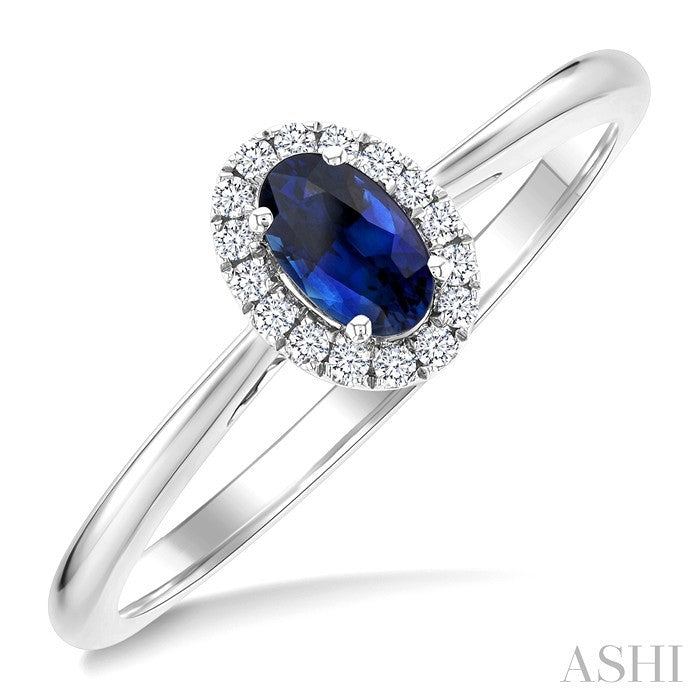 5x3 MM Oval Shape Sapphire and 1/20 Ctw Round Cut Diamond Halo Precious Ring in 10K White Gold