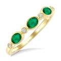 4X3 MM Oval Shape Emerald and 1/20 Ctw Bezel Set Round Cut Diamond Precious Fashion Band in 10K Yellow Gold