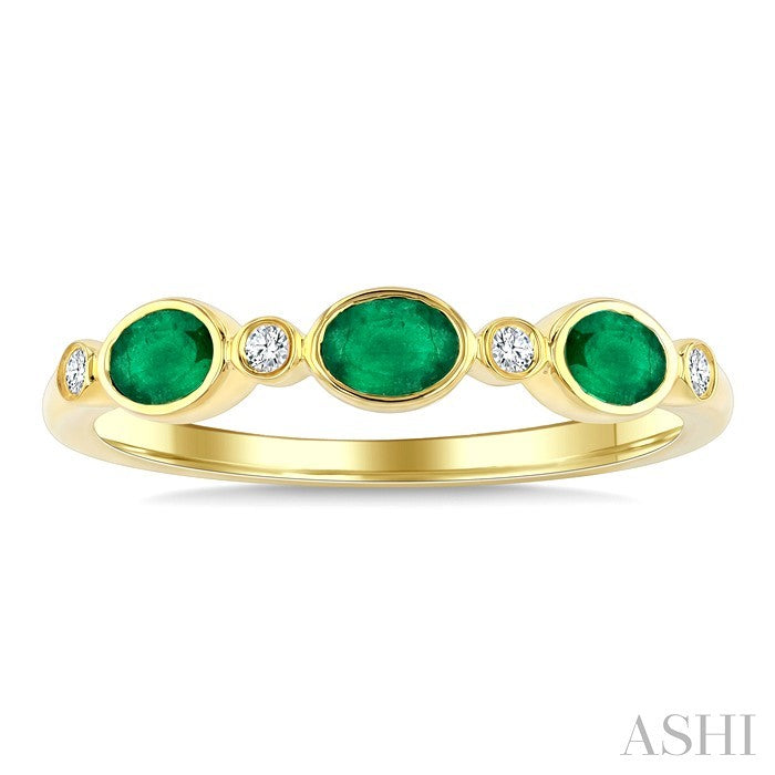 4X3 MM Oval Shape Emerald and 1/20 Ctw Bezel Set Round Cut Diamond Precious Fashion Band in 10K Yellow Gold