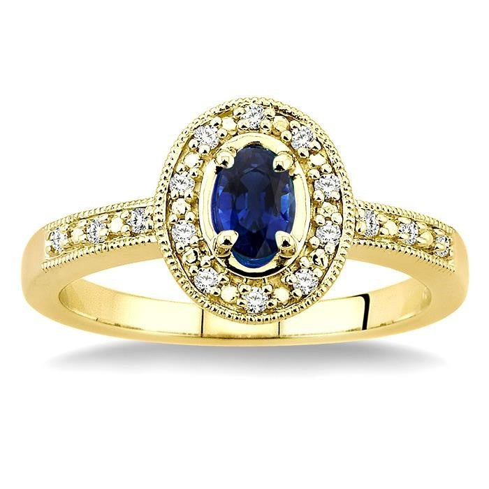 5x3 MM oval cut Sapphire and 1/10 Ctw Round Cut Diamond Ring in 14K Yellow Gold.
