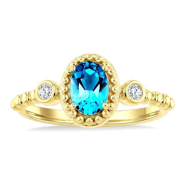 7X5 MM Oval Cut Blue Topaz and 1/20 Ctw Round Cut Diamond Semi-Precious Beaded Ring in 10K Yellow Gold