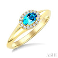 6X4 MM Oval Cut Blue Topaz and 1/8 Ctw Round Cut Diamond Semi-Precious Halo Ring in 10K Yellow Gold