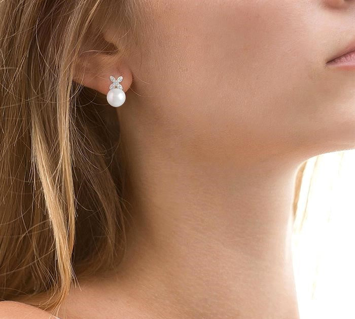 5.5 MM Round Shape Cultured Pearls and 1/20 Ctw Petite 4-Petal Flower Round Cut Diamond Fashion Stud Earrings in 10K White Gold