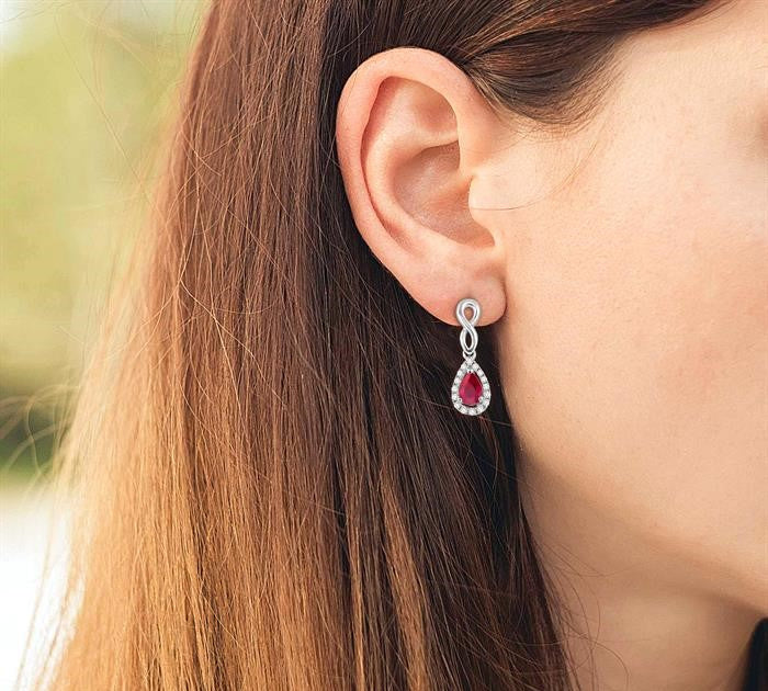 5x3 MM Pear Shape Ruby and 1/6 Ctw Round Cut Diamond Earrings in 10K White Gold