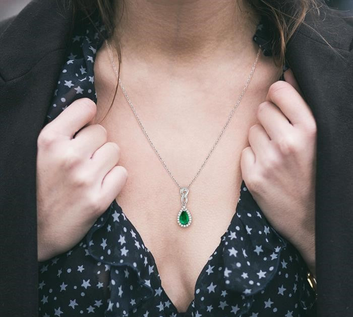 6x4 MM Pear Shape Emerald and 1/10 Ctw Round Cut Diamond Pendant in 10K White Gold with Chain