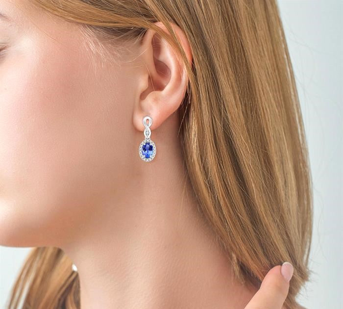 5x3 MM Oval Cut Tanzanite and 1/6 Ctw Round Cut Diamond Earrings in 14K White Gold