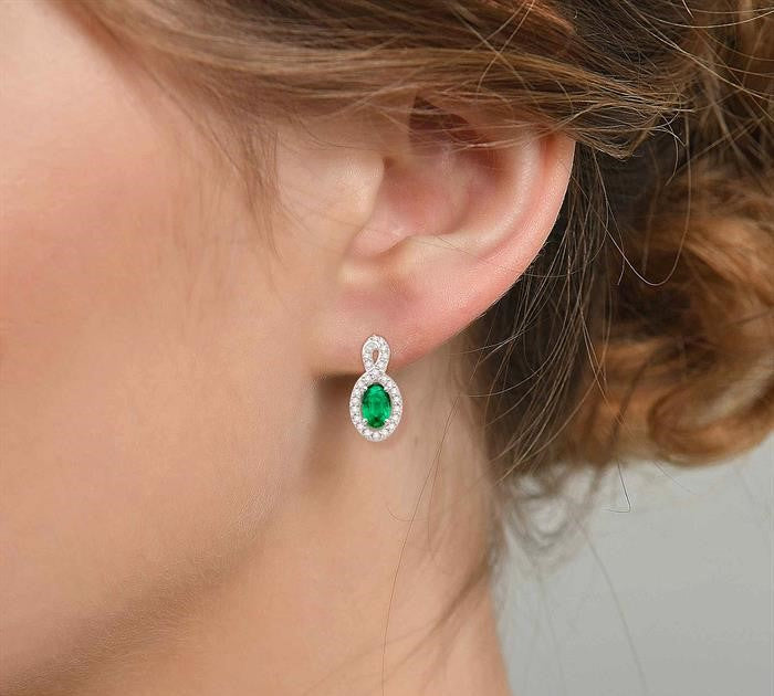 5x3 MM Oval Cut Emerald and 1/5 Ctw Round Cut Diamond Earrings in 10K White Gold