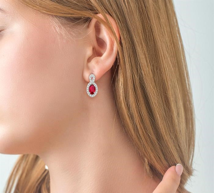 5x3 MM Oval Cut Ruby and 1/5 Ctw Round Cut Diamond Earrings in 10K White Gold