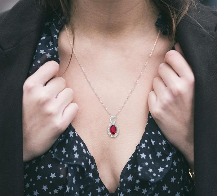 6x4 MM Oval Cut Ruby and 1/10 Ctw Round Cut Diamond Pendant in 14K White Gold with Chain