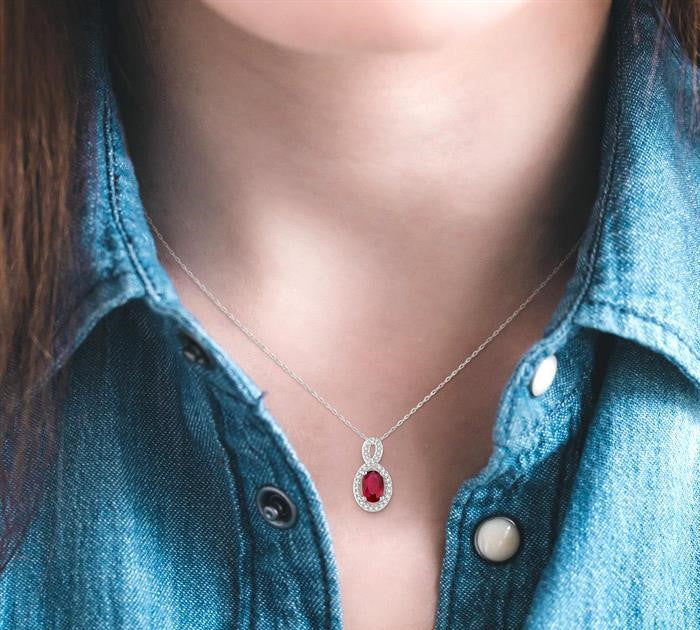 6x4 MM Oval Cut Ruby and 1/10 Ctw Round Cut Diamond Pendant in 10K White Gold with Chain