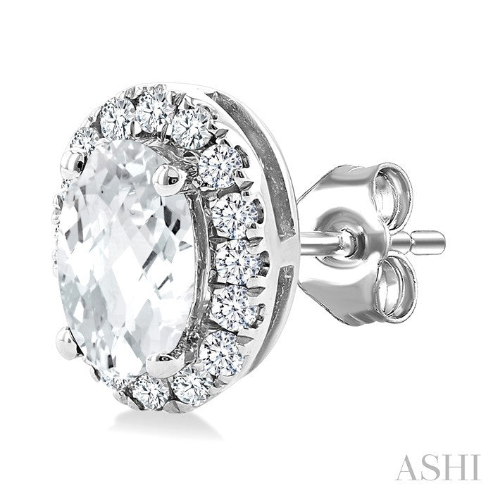 5x3 MM Oval Shape White Topaz and 1/8 Ctw Round Cut Diamond Halo Semi-Precious Stud Earrings in 14K White Gold