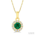 3.25 MM Round Emerald and 1/20 Ctw Round Cut Diamond Halo Precious Pendant with Chain in 10K Yellow Gold