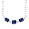 4X3MM Emerald Cut Sapphire and 1/50 Ctw Bezel Set Round Cut Diamond Precious Fashion Necklace in 10K White Gold