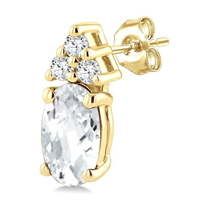 1/20 Ctw Oval Cut 5X3 MM White Topaz and Round Cut Diamond semi-precious Earrings in 14K Yellow Gold