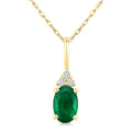 1/50 Ctw Oval Cut 6X4 MM Emerald and Round Cut Diamond Precious Pendant With Chain in 10K Yellow Gold