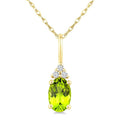1/50 Ctw Oval Cut 6X4 MM Peridot and Round Cut Diamond Semi-Precious Pendant With Chain in 10K Yellow Gold