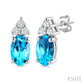 1/20 Ctw Oval Cut 5X3 MM Blue Topaz and Round Cut Diamond semi-precious Earrings in 14K White Gold