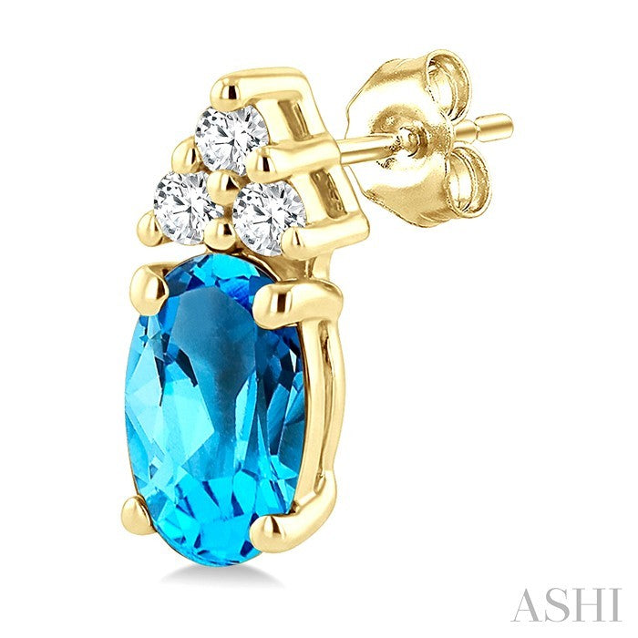 1/20 Ctw Oval Cut 5X3 MM Blue Topaz and Round Cut Diamond semi-precious Earrings in 14K Yellow Gold