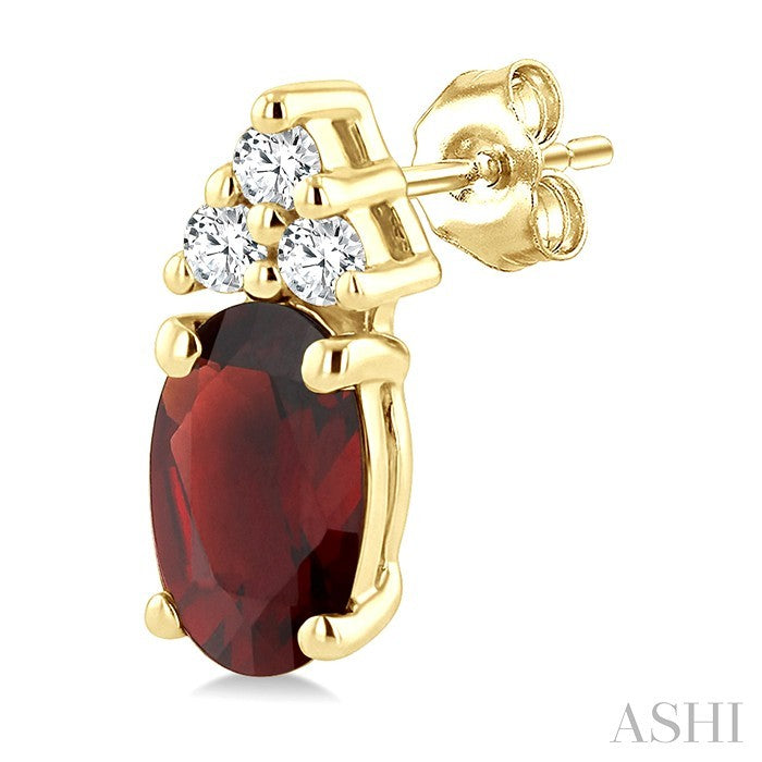 1/20 Ctw Oval Cut 5X3 MM Garnet and Round Cut Diamond semi-precious Earrings in 14K Yellow Gold