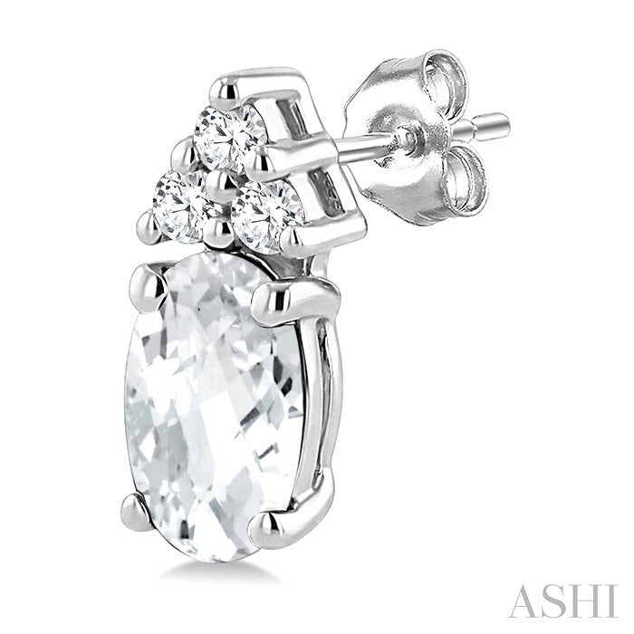 1/20 Ctw Oval Cut 5X3 MM White Topaz and Round Cut Diamond semi-precious Earrings in 14K White Gold