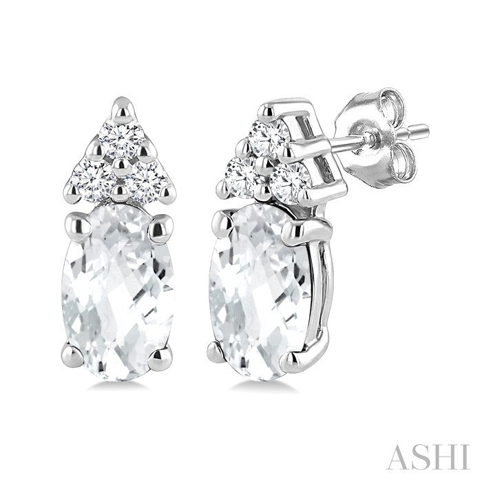 1/20 Ctw Oval Cut 5X3 MM White Topaz and Round Cut Diamond semi-precious Earrings in 14K White Gold