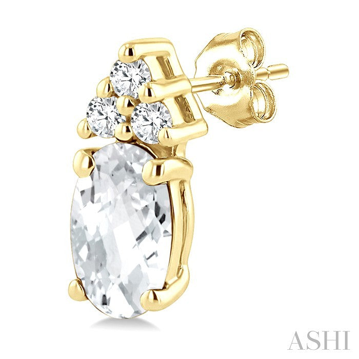 1/20 Ctw Oval Cut 5X3 MM White Topaz and Round Cut Diamond semi-precious Earrings in 14K Yellow Gold