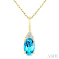 1/50 Ctw Oval Cut 6X4 MM Blue Topaz and Round Cut Diamond semi-precious Pendant With Chain in 14K Yellow Gold