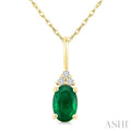 1/50 Ctw Oval Cut 6X4 MM Emerald and Round Cut Diamond Precious Pendant With Chain in 14K Yellow Gold