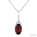 1/50 Ctw Oval Cut 6X4 MM Garnet and Round Cut Diamond Semi-Precious Pendant With Chain in 14K White Gold