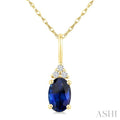 1/50 Ctw Oval Cut 6X4 MM Sapphire and Round Cut Diamond Precious Pendant With Chain in 14K Yellow Gold