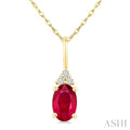1/50 Ctw Oval Cut 6X4 MM Ruby and Round Cut Diamond Precious Pendant With Chain in 10K Yellow Gold