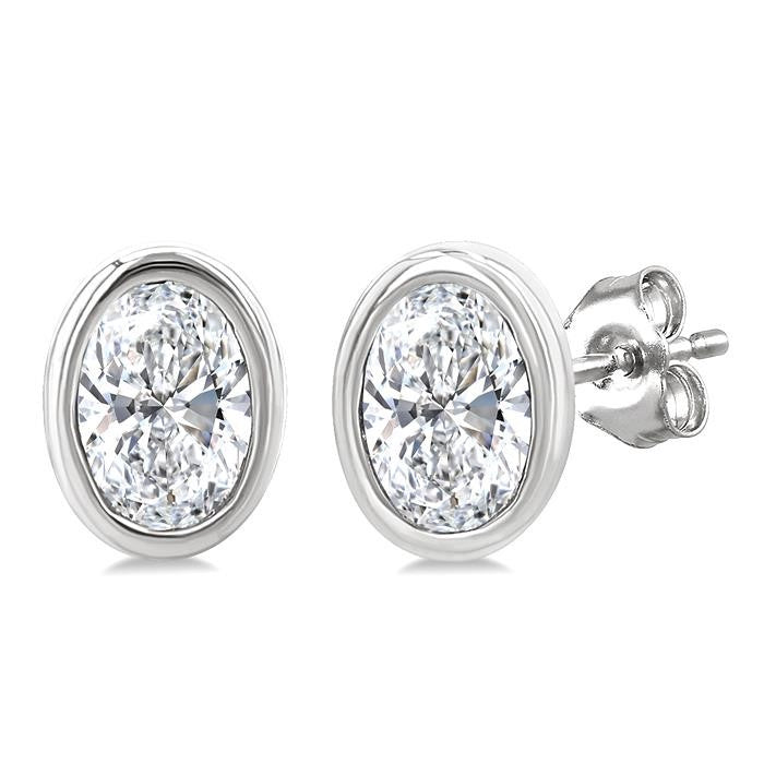 1/5 Ctw Petite Bezel Set Oval Cut Diamond Fashion Stud Earrings in 10K White Gold