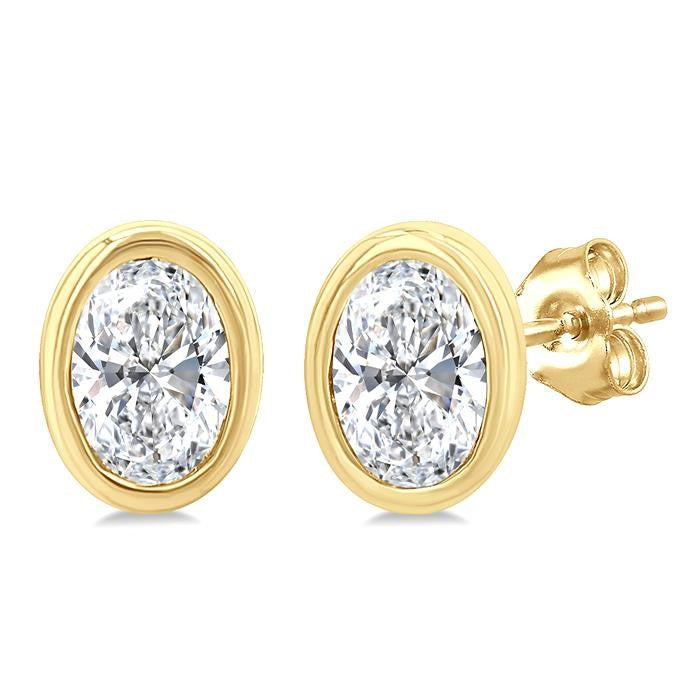 1/5 Ctw Petite Bezel Set Oval Cut Diamond Fashion Stud Earrings in 10K Yellow Gold
