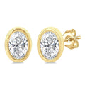 1/5 Ctw Petite Bezel Set Oval Cut Diamond Fashion Stud Earrings in 10K Yellow Gold